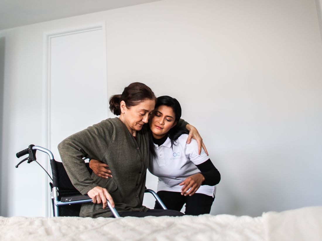 Ahsan Care team member supporting a participant, warm and professional