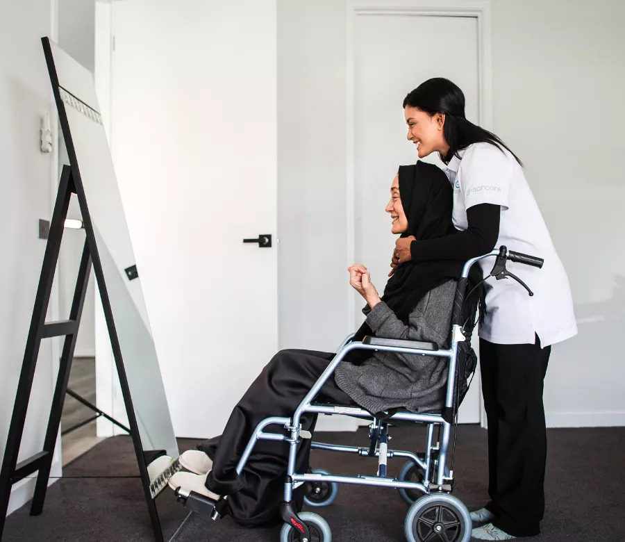 Support worker writing shift notes with a participant